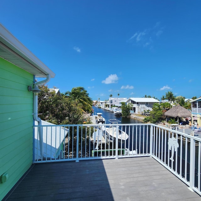 wooden deck featuring a water view