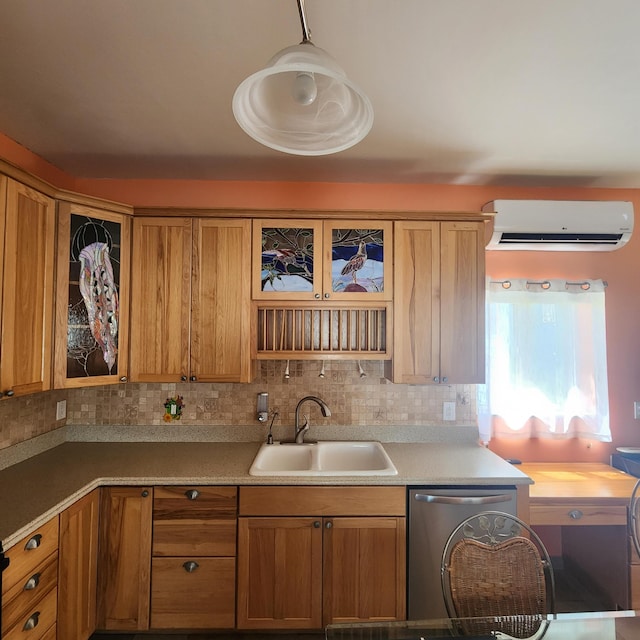 kitchen featuring a wall mounted air conditioner, dishwasher, brown cabinetry, a sink, and glass insert cabinets