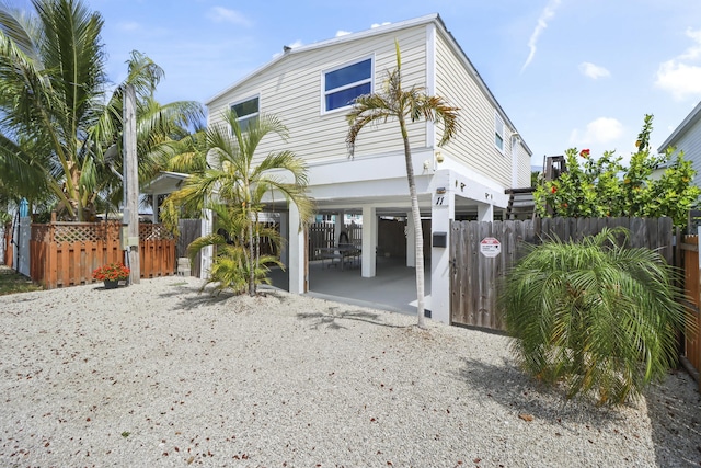 11 El Monte Ln, Big Coppitt, FL 33040 - back of property with a gate, a carport, and fence private yard