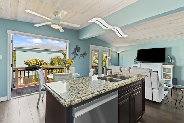 kitchen with a sink, lofted ceiling with beams, open floor plan, wooden ceiling, and dishwasher