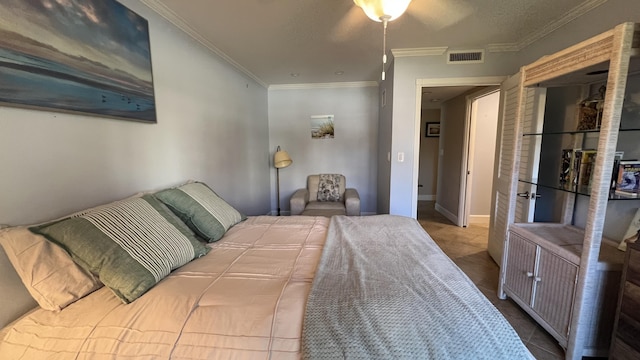 bedroom featuring crown molding and tile patterned flooring