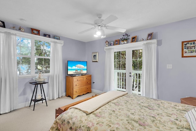 bedroom with light carpet, access to exterior, ceiling fan, and french doors