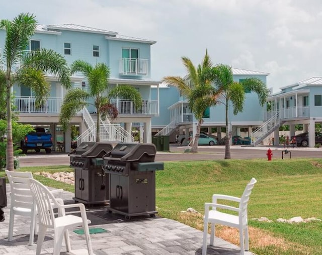 view of community featuring a yard and stairway