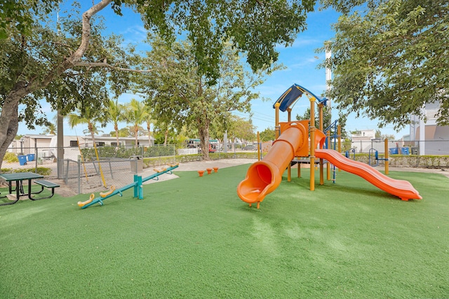 view of play area featuring a lawn