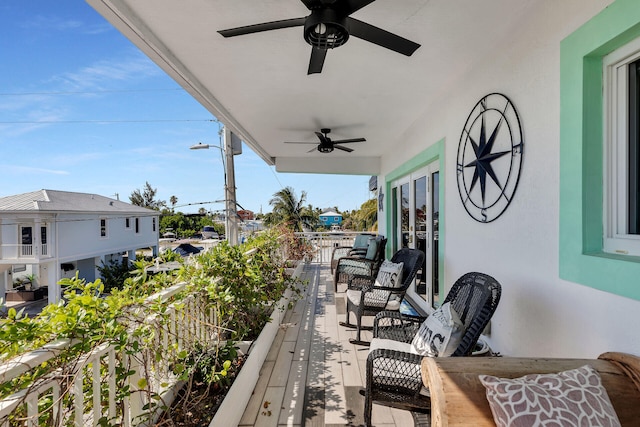 balcony featuring ceiling fan