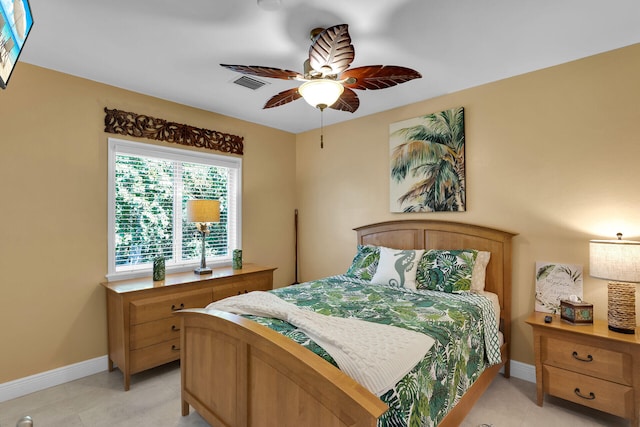 tiled bedroom with ceiling fan