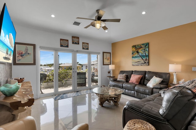 living room with ceiling fan and light tile patterned floors