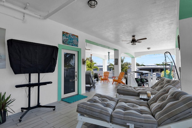 exterior space featuring ceiling fan