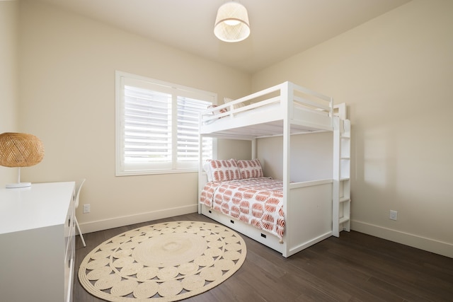 bedroom featuring dark wood-type flooring