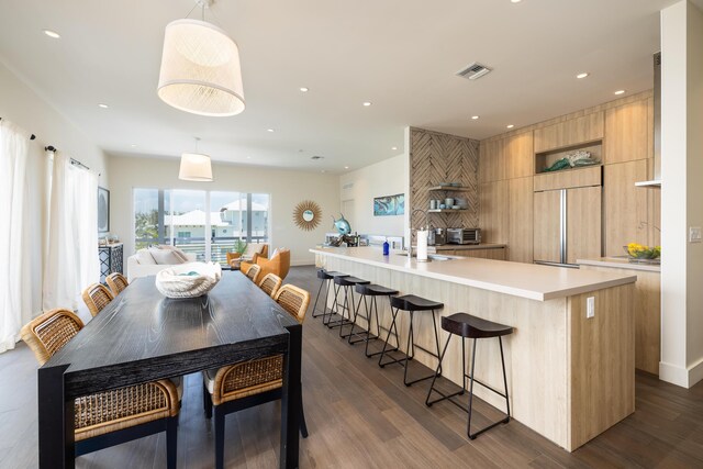 dining space with dark hardwood / wood-style floors