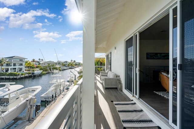 balcony featuring a water view