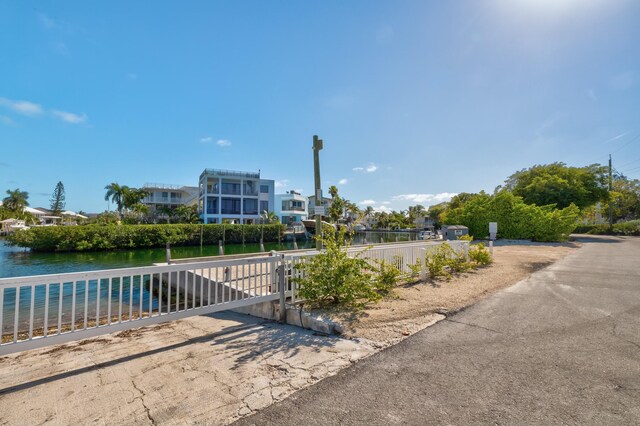 surrounding community featuring a water view