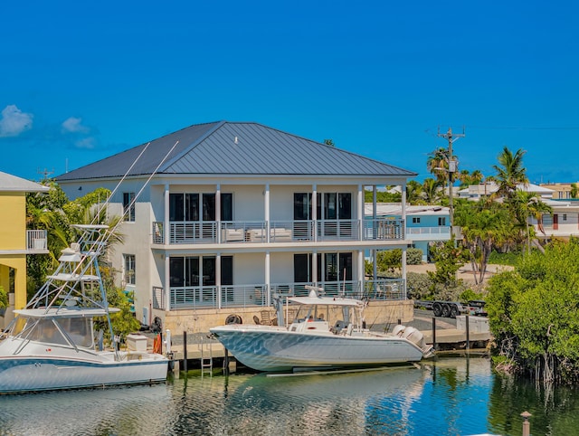 back of house featuring a water view