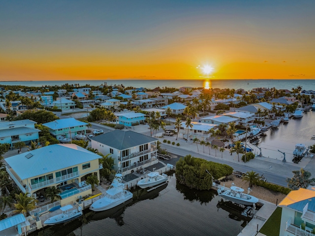 aerial view at dusk with a water view