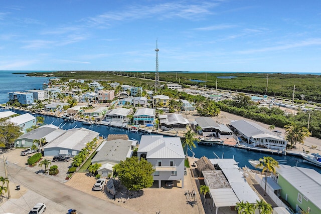 aerial view featuring a water view and a residential view