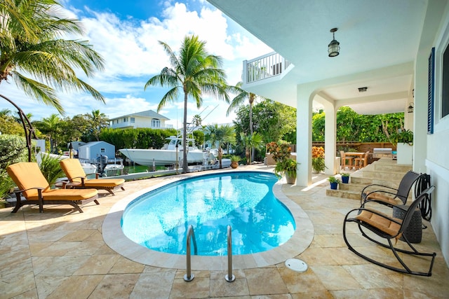 view of pool featuring a patio area