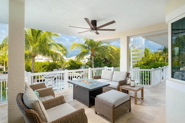 view of patio / terrace featuring an outdoor living space with a fire pit and ceiling fan