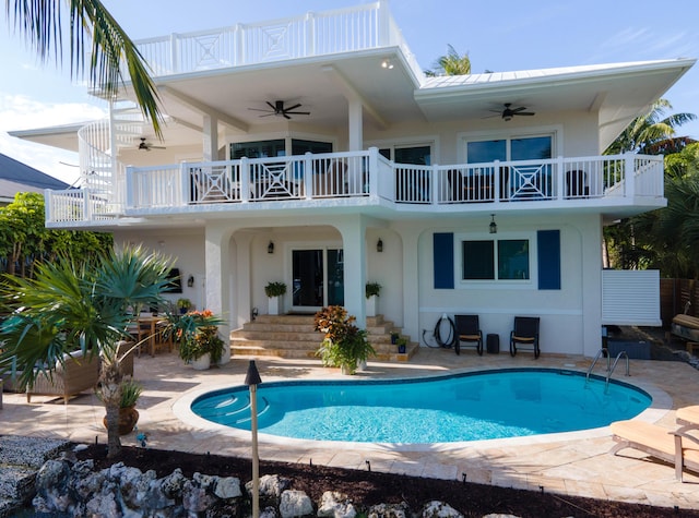 rear view of property with a patio area, a balcony, and ceiling fan