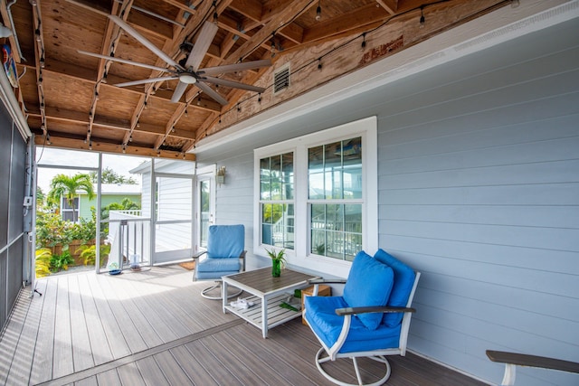 sunroom / solarium featuring vaulted ceiling and ceiling fan