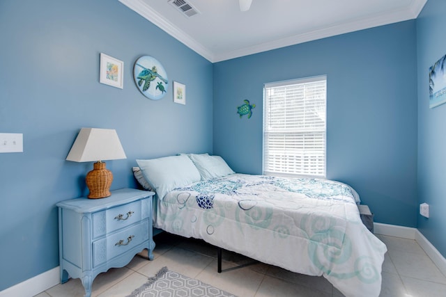 bedroom featuring light tile patterned floors, ornamental molding, and ceiling fan