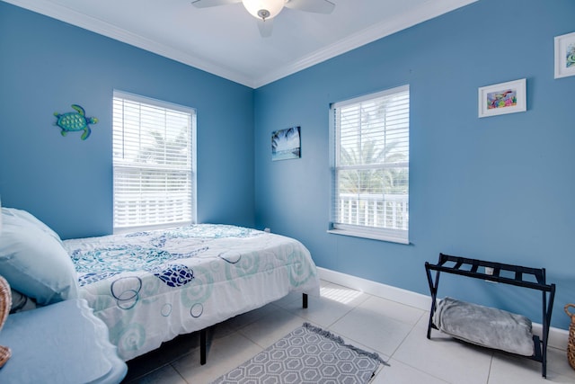 tiled bedroom with ornamental molding and ceiling fan