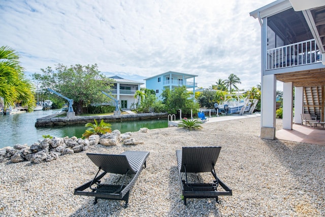 exterior space featuring a water view and a patio area