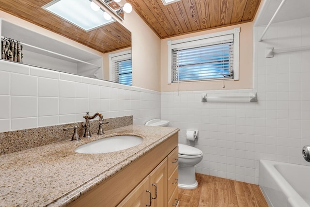 full bathroom featuring tile walls, hardwood / wood-style flooring, vanity, wood ceiling, and toilet