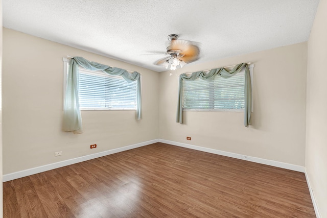 unfurnished room with hardwood / wood-style floors, a textured ceiling, and ceiling fan