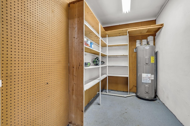 utility room featuring water heater