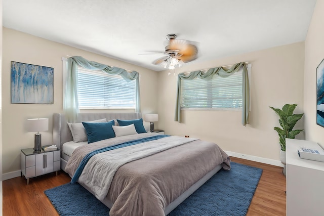 bedroom featuring ceiling fan and dark hardwood / wood-style flooring