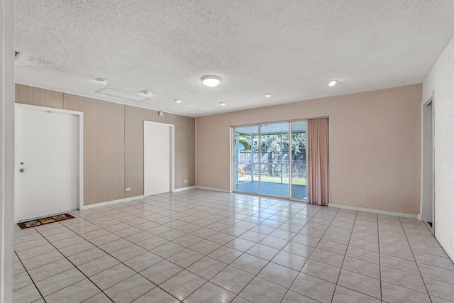 empty room featuring a textured ceiling