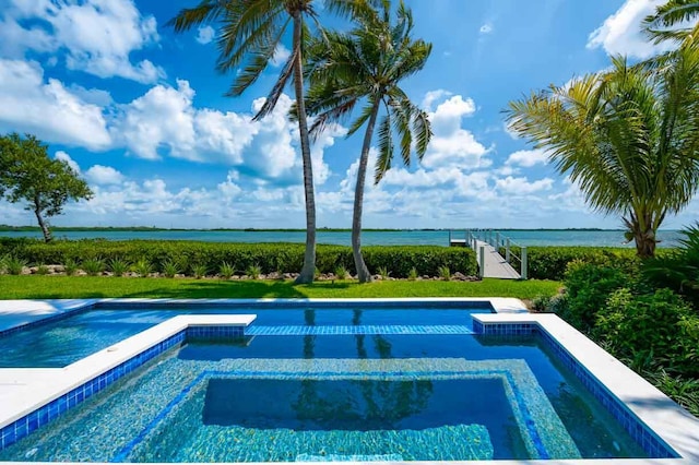 view of pool with a water view