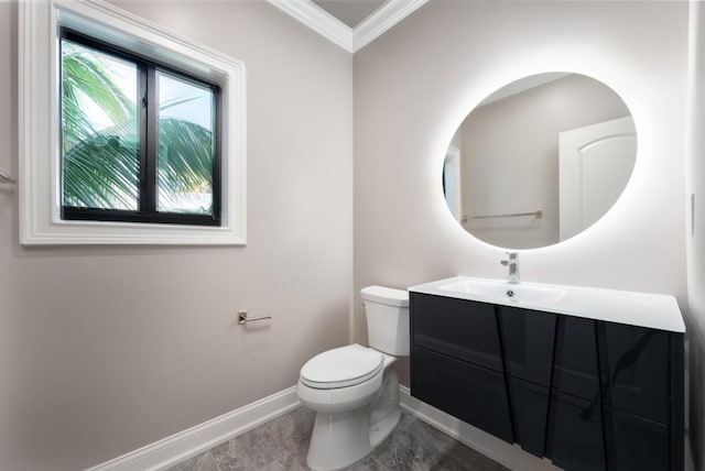 bathroom featuring vanity, crown molding, and toilet