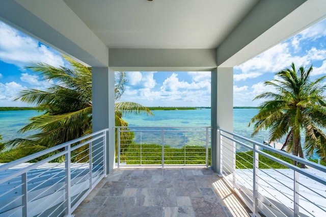 balcony featuring a water view