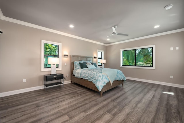 bedroom with crown molding, dark hardwood / wood-style floors, and ceiling fan