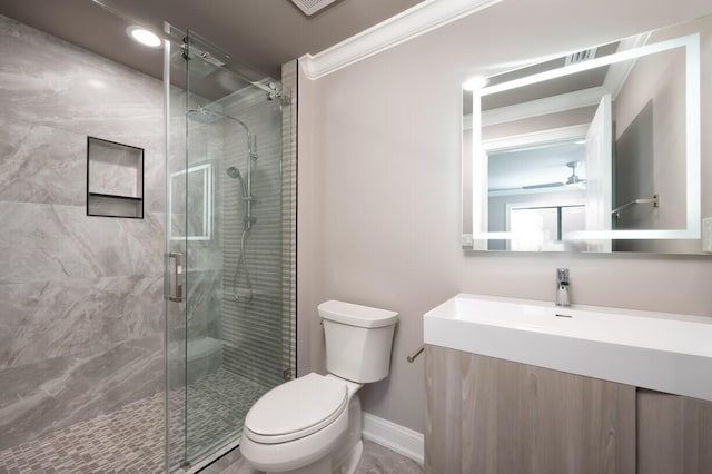 bathroom featuring vanity, an enclosed shower, ornamental molding, and toilet