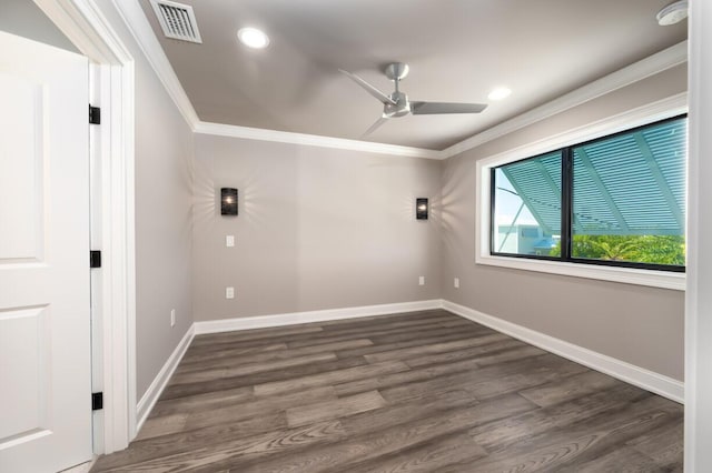 empty room with ceiling fan, ornamental molding, and dark hardwood / wood-style flooring