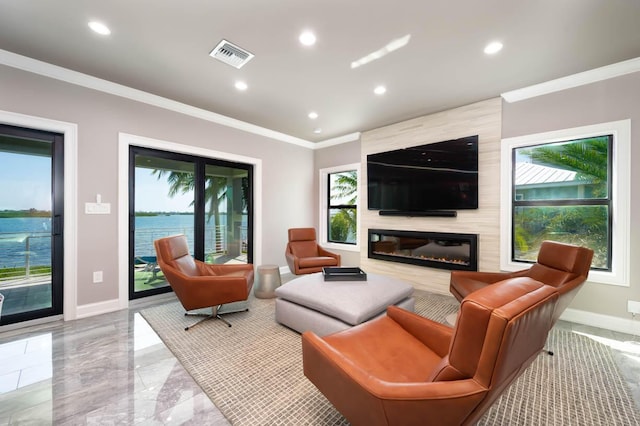 living room featuring ornamental molding and a high end fireplace