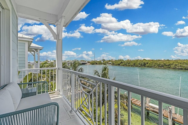 balcony featuring a water view