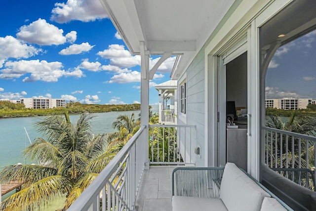 balcony featuring a water view