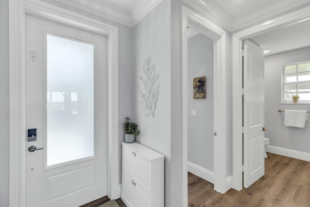 interior space with baseboards and wood finished floors