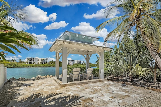 view of patio with a water view