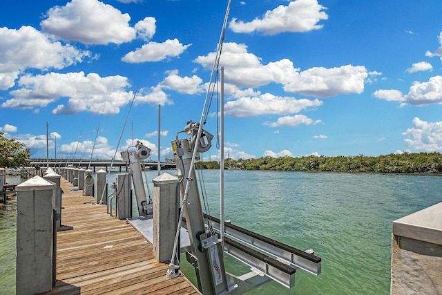 view of dock featuring a water view and boat lift