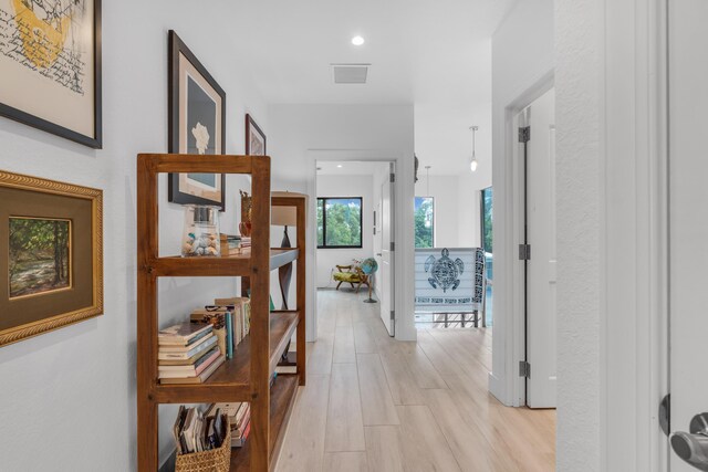 hallway with light wood-type flooring