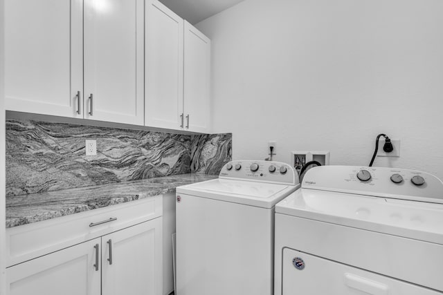 laundry area with cabinets and independent washer and dryer