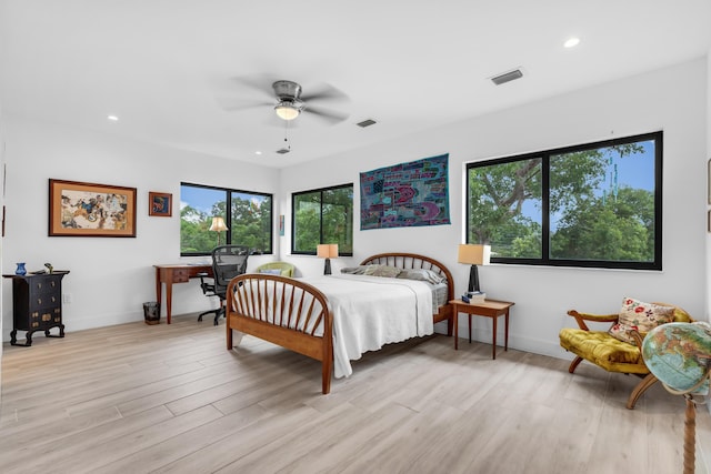 bedroom with ceiling fan and light hardwood / wood-style flooring