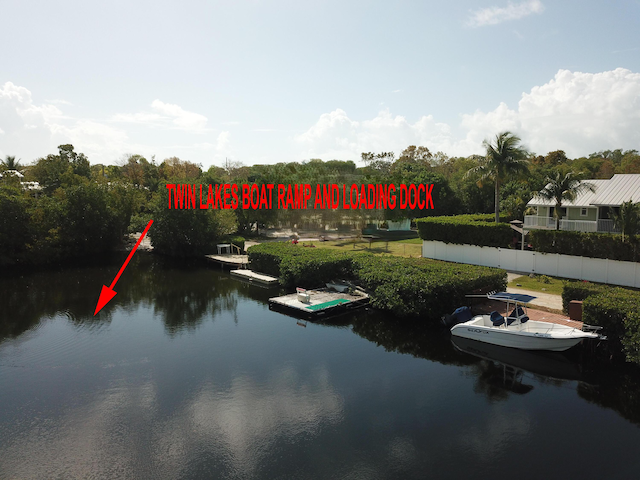 property view of water featuring a boat dock