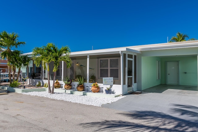 exterior space featuring a carport