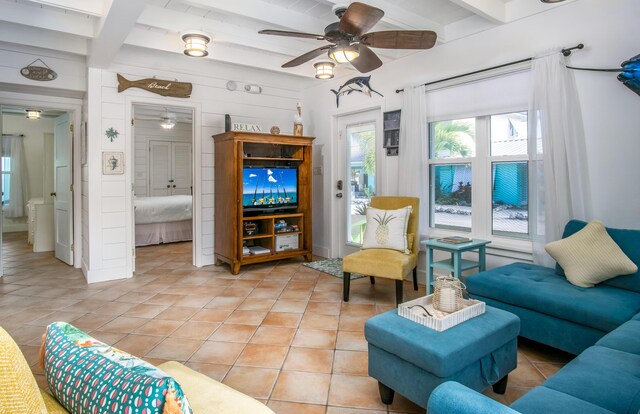 kitchen with sink, hanging light fixtures, beam ceiling, light tile patterned floors, and white appliances