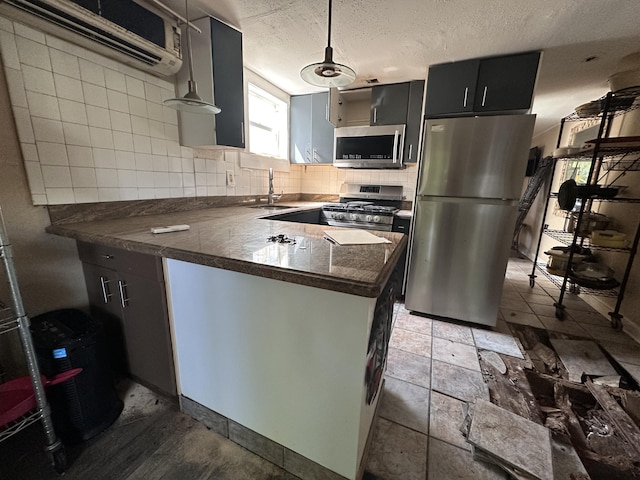 1014 Varela St Unit 3, Key West, FL 33040 - kitchen featuring a sink, tasteful backsplash, a textured ceiling, stainless steel appliances, and dark countertops